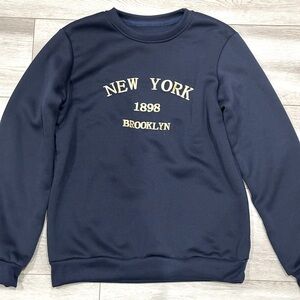 Blue Sweater with statement in the front 
💙